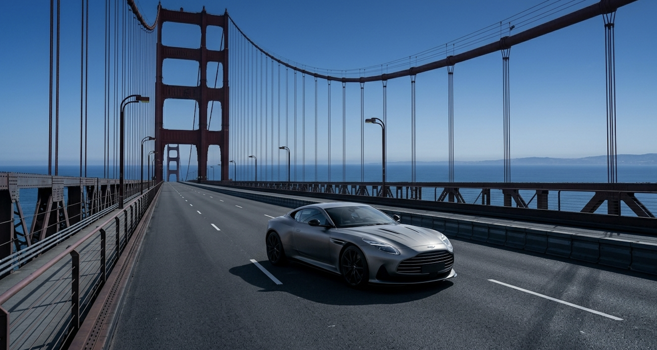 A sleek modern vehicle parked on a suspension bridge overlooking a blue horizon